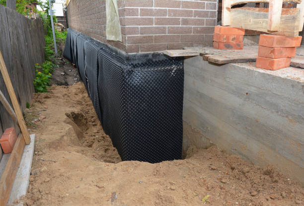 SJ Waterproofing Pros technician performing targeted Exterior Waterproofing assessment in Schiller Park, IL